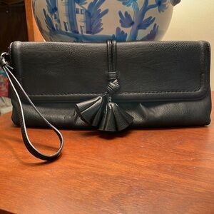 Cute simply Vera Wang tassel clutch.
